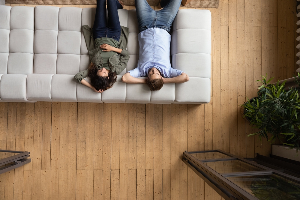 Illustration of Comfort due to the roofing design/system: Couple relaxing because of the roof ventilation.

