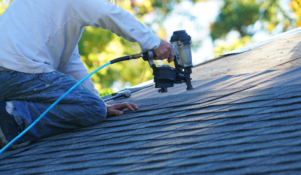 roofing services: roof repair using nail gun
